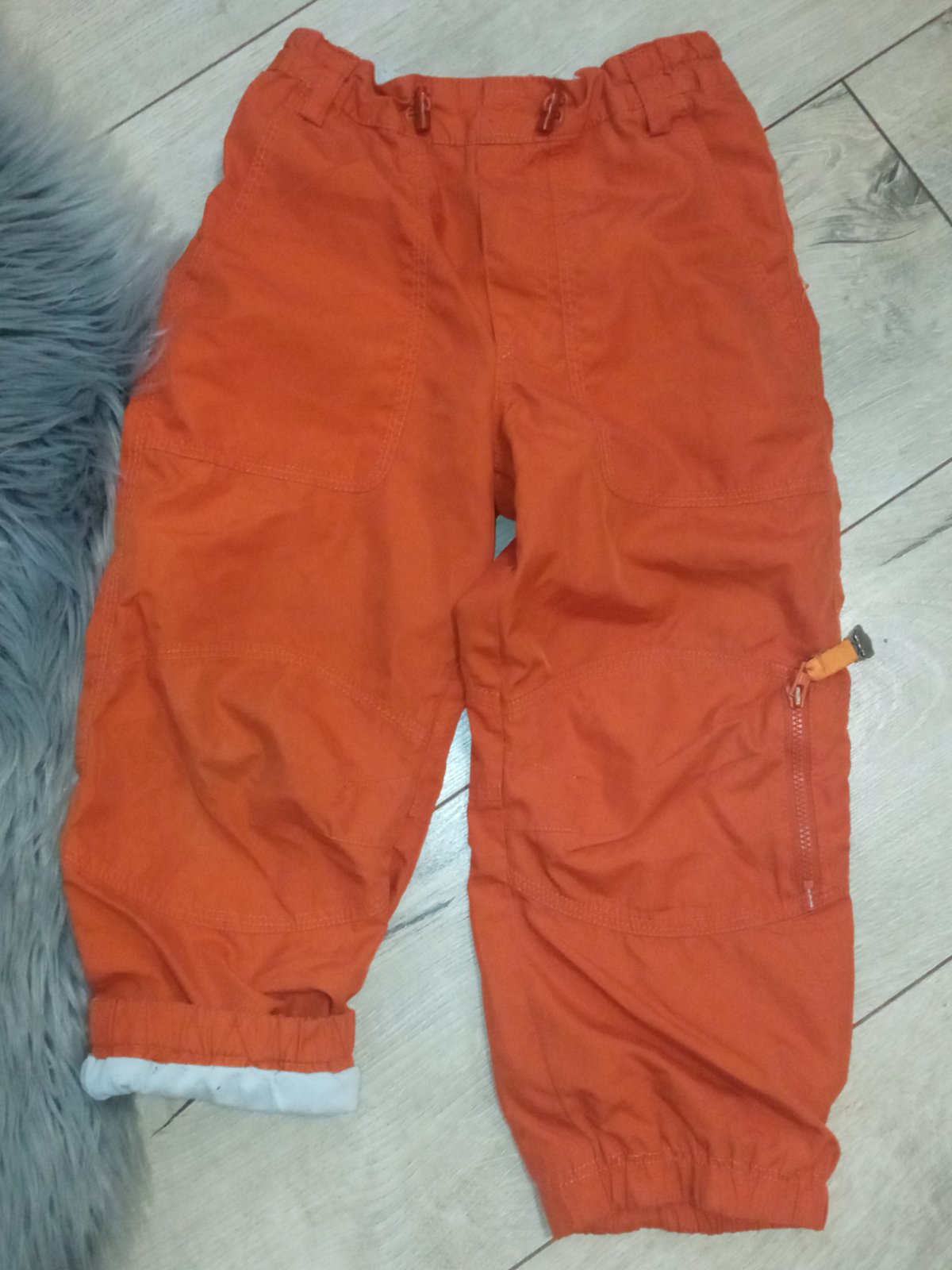 Oranžové zateplené nohavice (3-4r.)